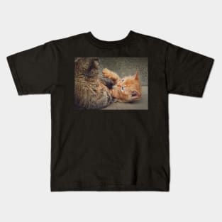 Playful orange kitten Kids T-Shirt